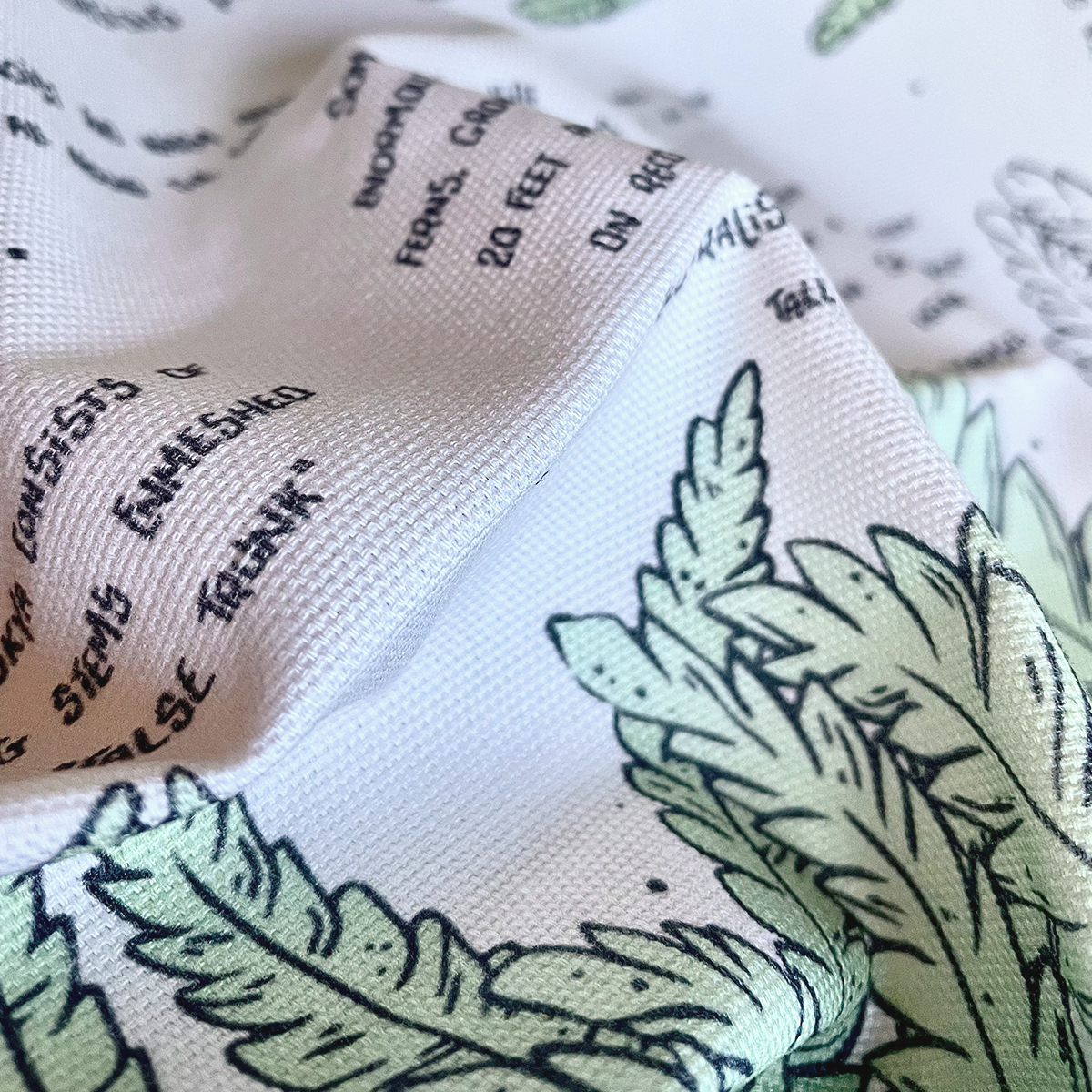 manchester and york museums stocking triceratops ferns tea towel, close up of printed fabric