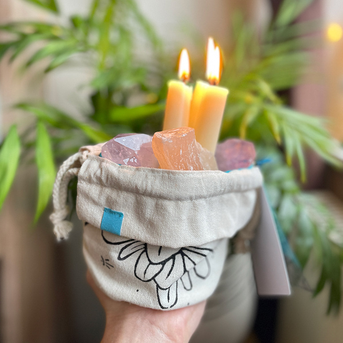 folded on the hem, tiny drawstring bag with crystals and lit candles inside, cotton canvas in cream fabric