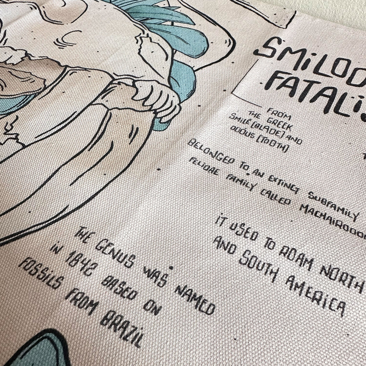 Smilodon & Lion Skull Compendium Tea Towel