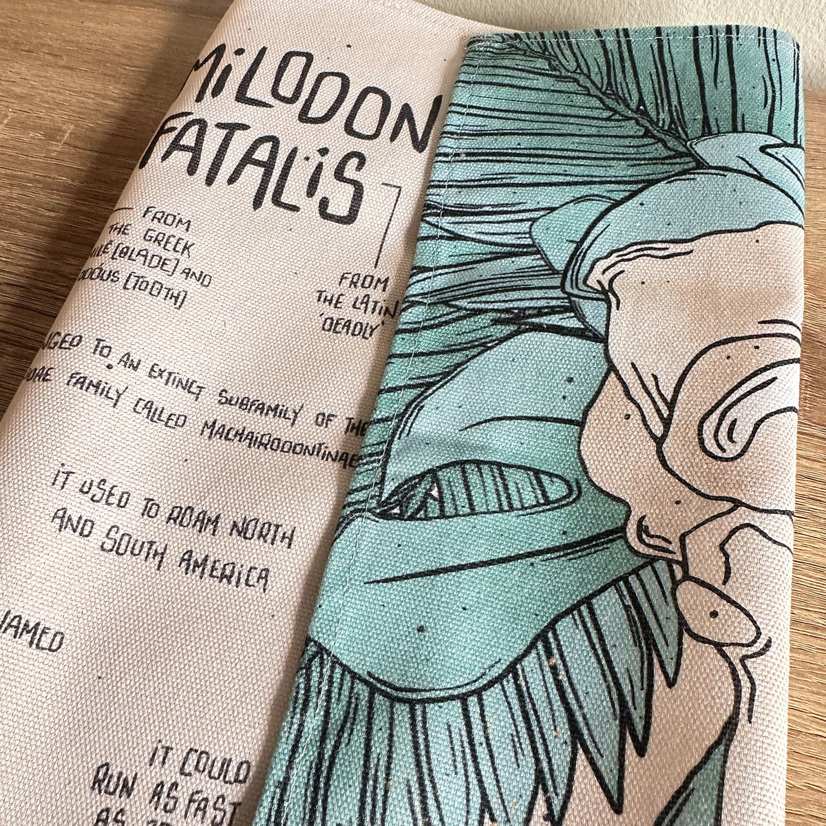 Smilodon & Lion Skull Compendium Tea Towel