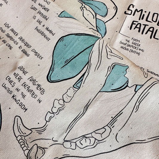 Smilodon & Lion Skull Compendium Tea Towel