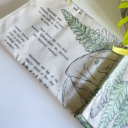 manchester and york museums gift shop triceratop dinosaur tea towel, folded illustrated fabric, curious facts