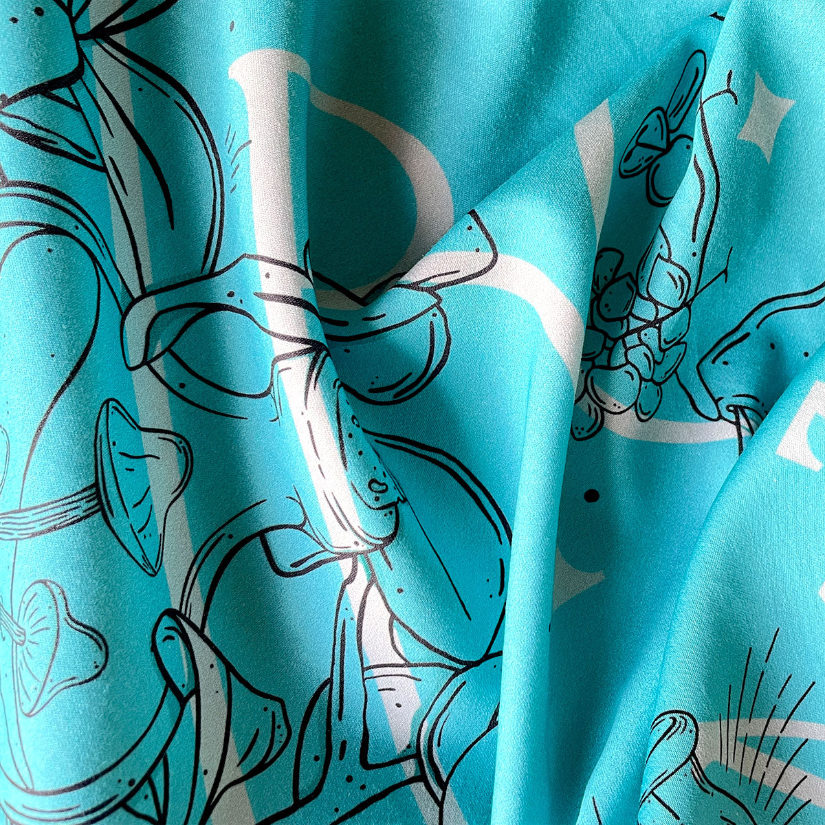 Printed bandana featuring a unique design with Earth, crystals, plants, and bones. Perfect for nature lovers, bohemian fashion, or occult enthusiasts. Turquoise Teal Colour.