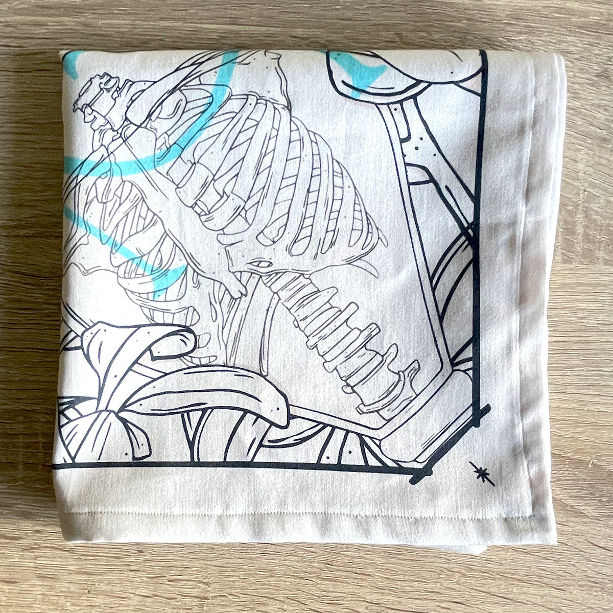 Folded bandana featuring a unique design of skeleton in glass jar. Perfect for nature lovers, bohemian fashion, or occult enthusiasts. Cream colour.