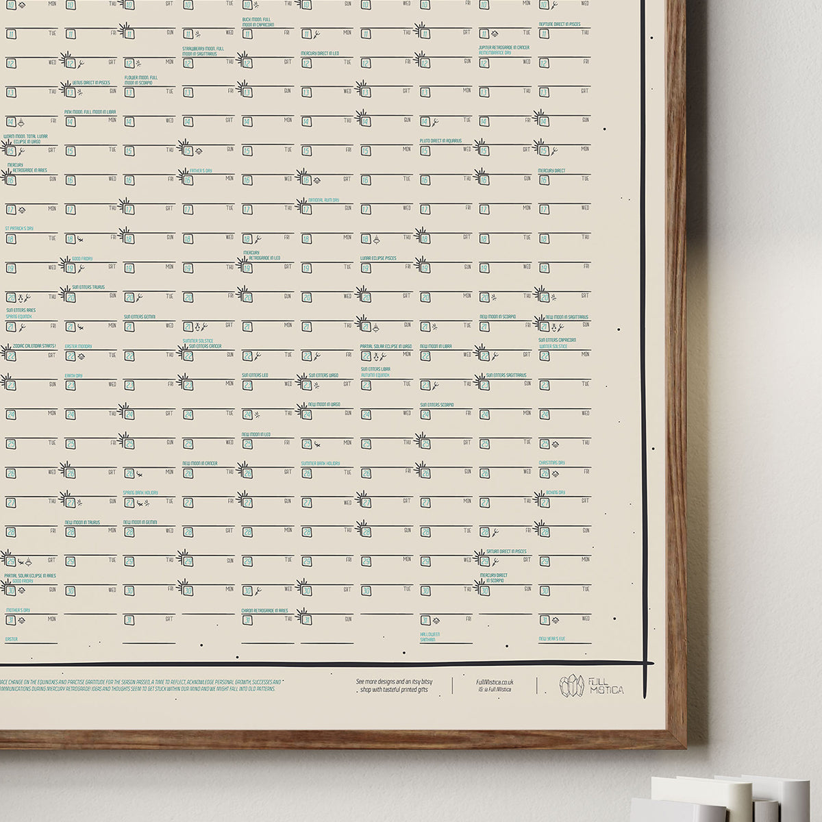 framed calendar close up shows bottom right of frame and design details with several lines for the days of the year; special days listed on several dates; logo, key and extra info on footer