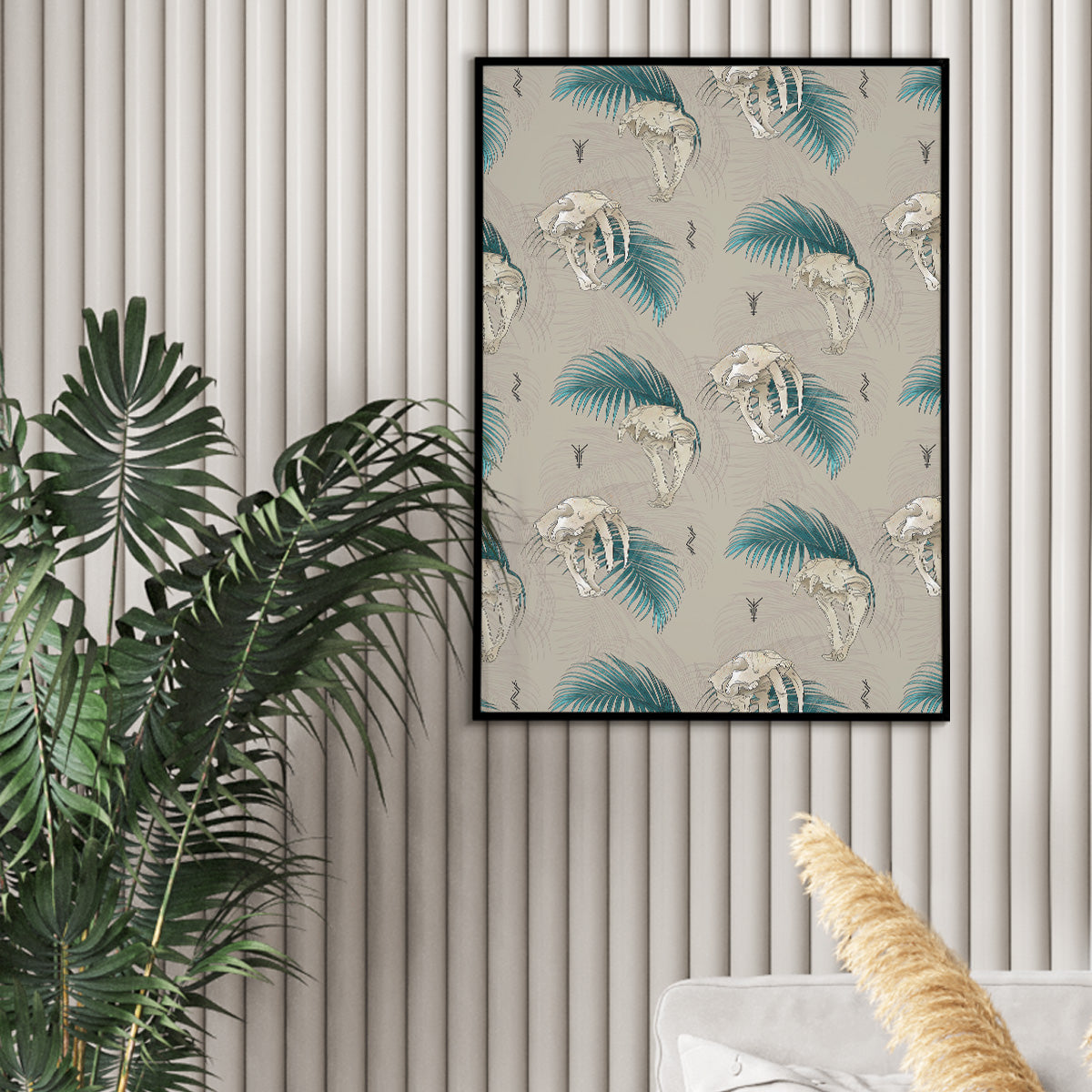 art print hanging with plant sitting to the left, design of all over pattern of lion and saber tooth skulls with open mouths, palm leaves up and down with outlined leaves as watermarks on cream background, rune icons scattered